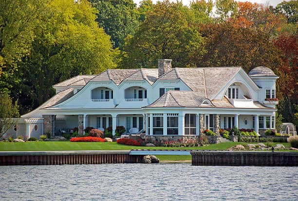 Large white summer home on the lake.