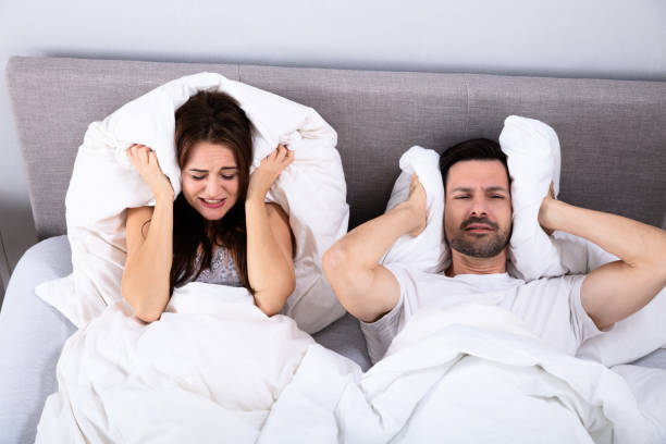 Disturbed Couple Covering Their Ears 