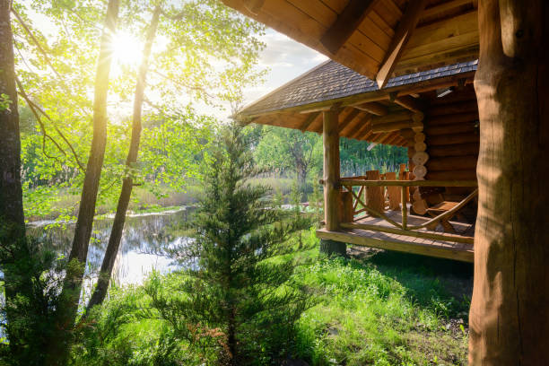 Wooden house and pond at the sunrise